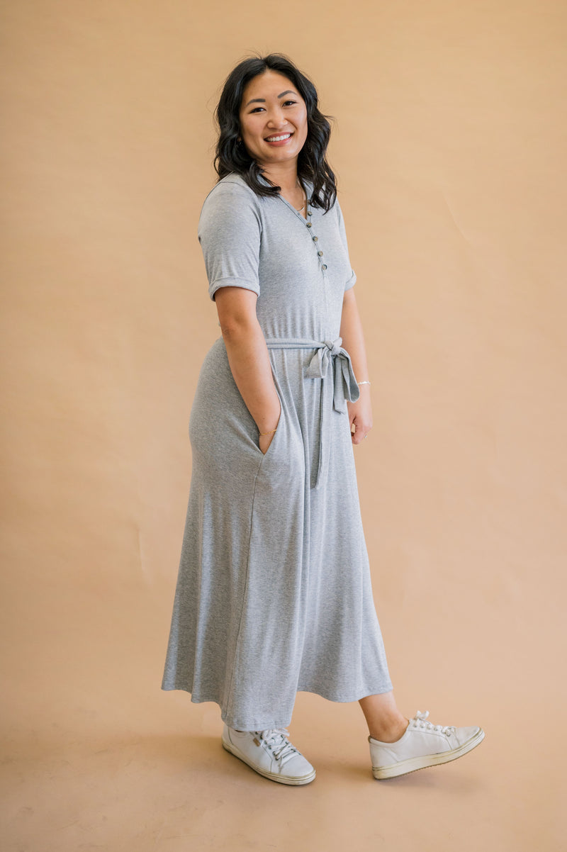Effortlessly stylish and easy to care for: Merrick White's modest, machine washable gray ribbed henley dress, complete with rolled sleeves on our model
