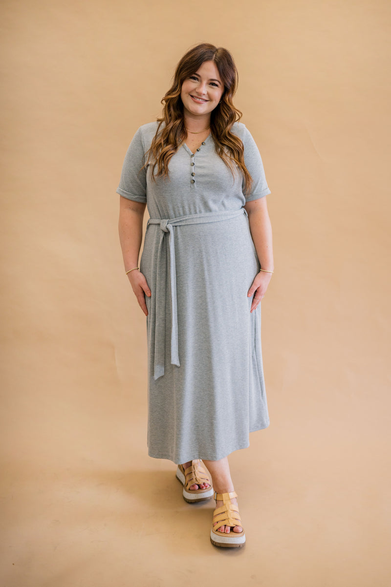 Spring essential: Merrick White's modest, machine washable gray ribbed henley dress with rolled sleeves, perfect for effortless style and practicality, as seen on our model.