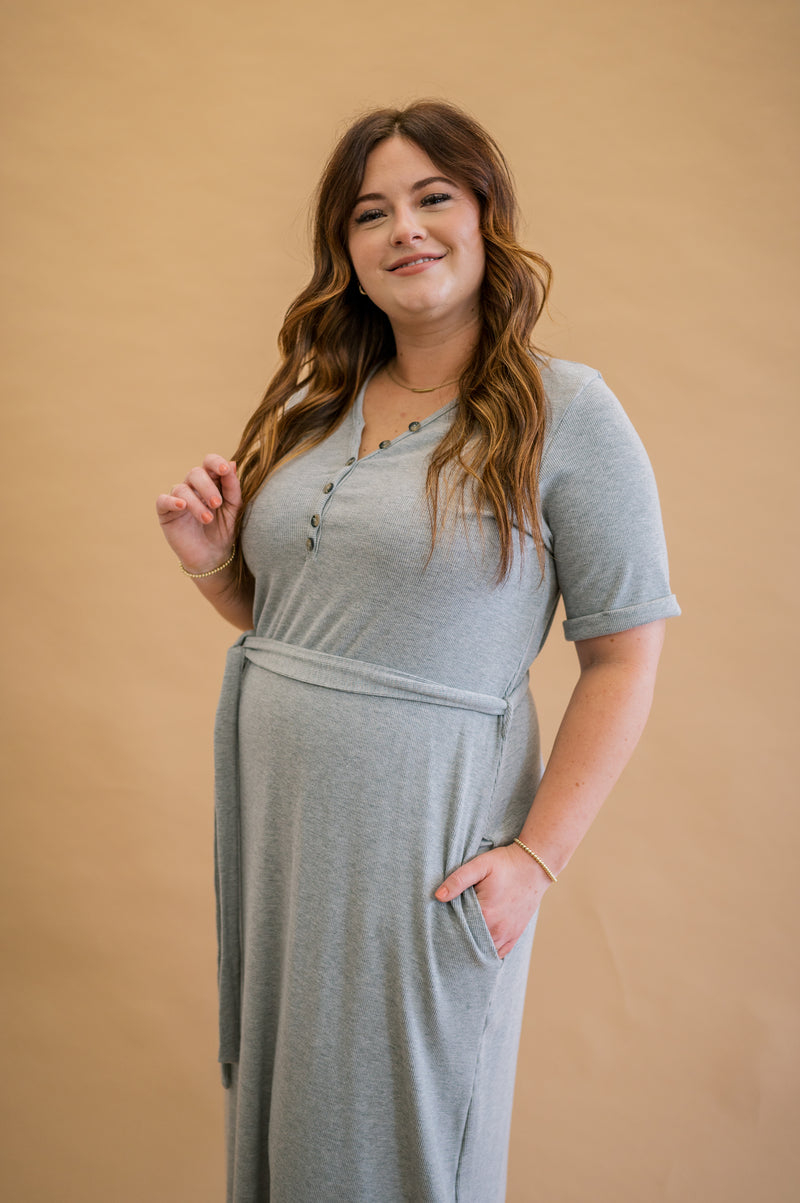 Stay chic and comfortable: Merrick White's modest gray ribbed henley dress, machine washable and featuring rolled sleeves, as demonstrated by our model