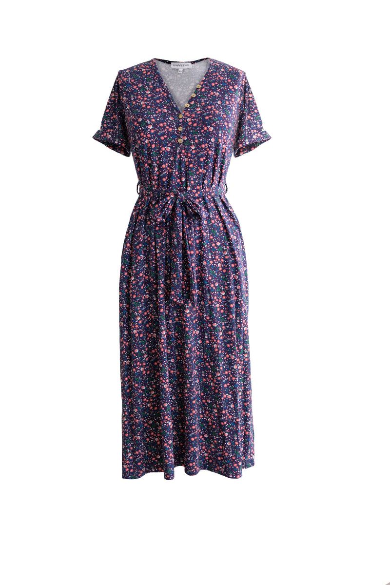 Navy Floral Henley Dress with rolled sleeves, gold buttons, removable tie and pockets. 